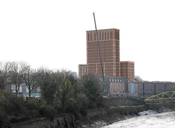 A photo of York street, south Bristol and the banana bridge. With a proposed tower block overlaid - its a huge ugly tower looming over the area.