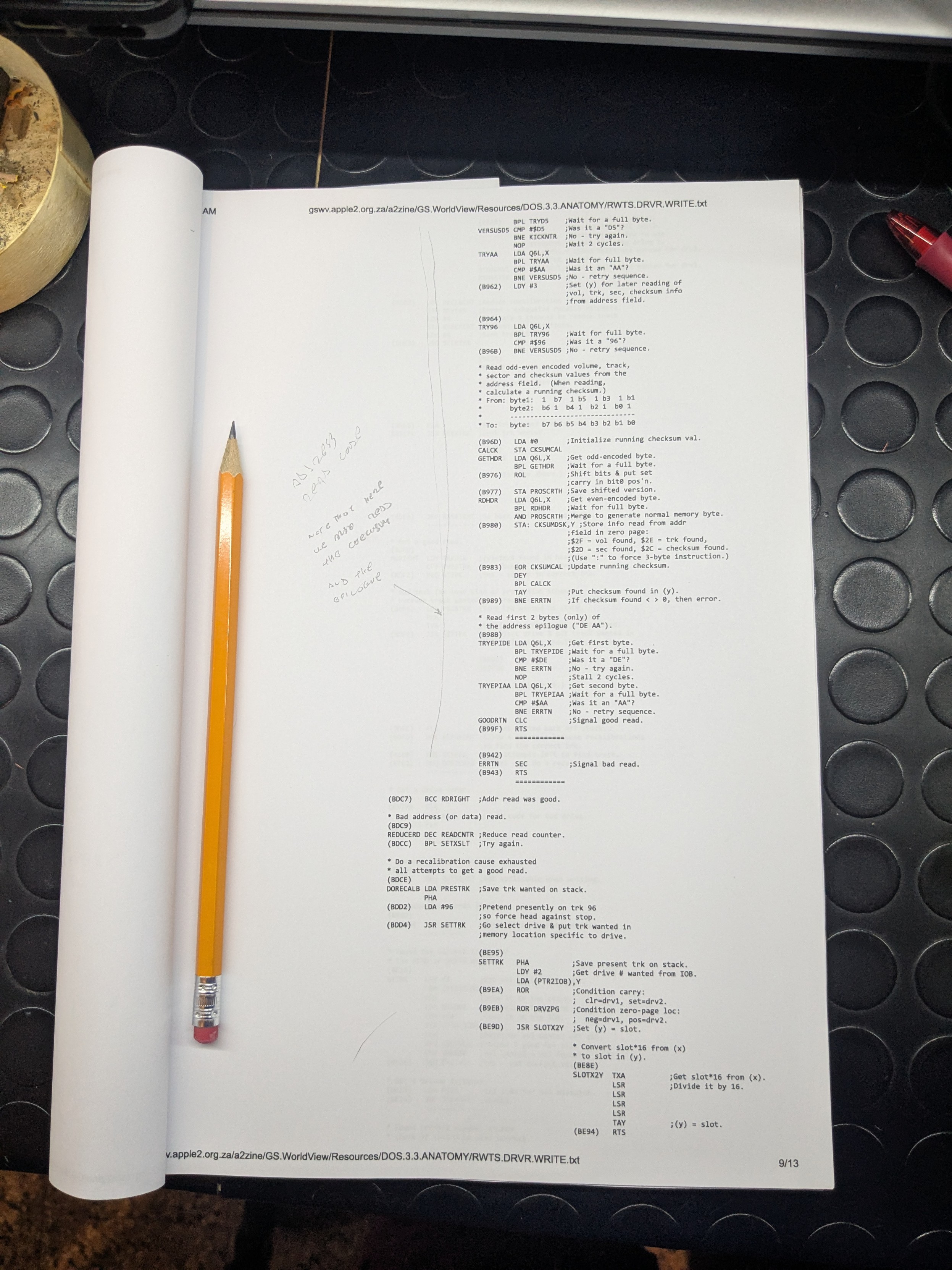 Photo of a code listing printed on a sheet, some notes taken on a side with a pencil. Photo of a code listing printed on a sheet, some notes taken on a side with a pencil.