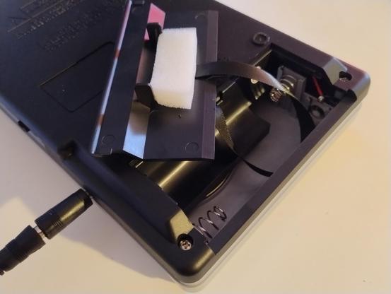Open battery compartment on a cassette player that takes C batteries
