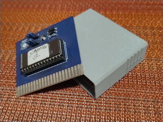 A circuit board with a ROM on it with a hand written label