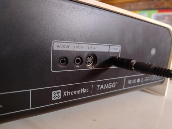 Back of an XtremeMac speaker dock showing AV out, line in, and S-video out sockets
