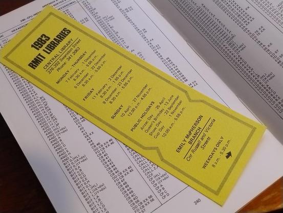 A bookmark printed with the opening hours for the RMIT libraries in 1983