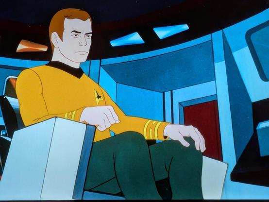 Captain Kirk sitting in his big chair, from the animated series of Star Trek 