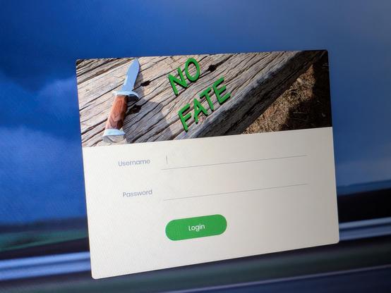 A login screen prompting for username and password, under a banner image of a knife lying on a wooden table and the text 